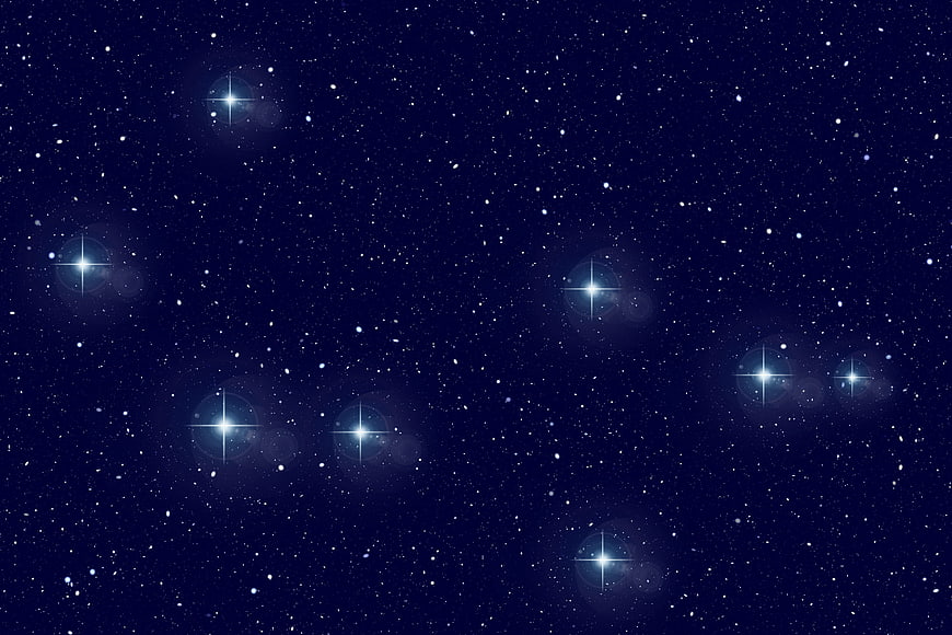 Deep blue starry night sky with bright twinkling stars