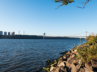 Verrazzano-Narrows Bridge View from Shoreline with City Skyline