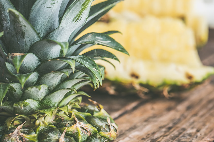 Fresh Green Pineapple Close-Up on Rustic Wooden Table