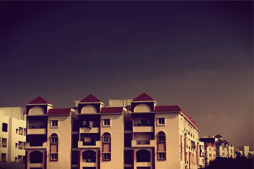 Residential Apartment Buildings Under Dark Moody Sky