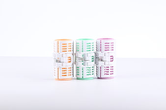 Pastel Hair Rollers on White Background