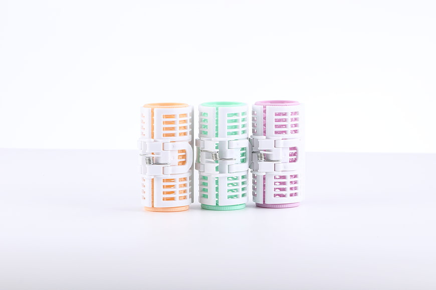 Pastel Hair Rollers on White Background