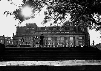 Couple Walking Away in Black and White Prague Cityscape