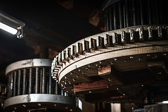 Close-up of vintage wooden industrial gears in a workshop