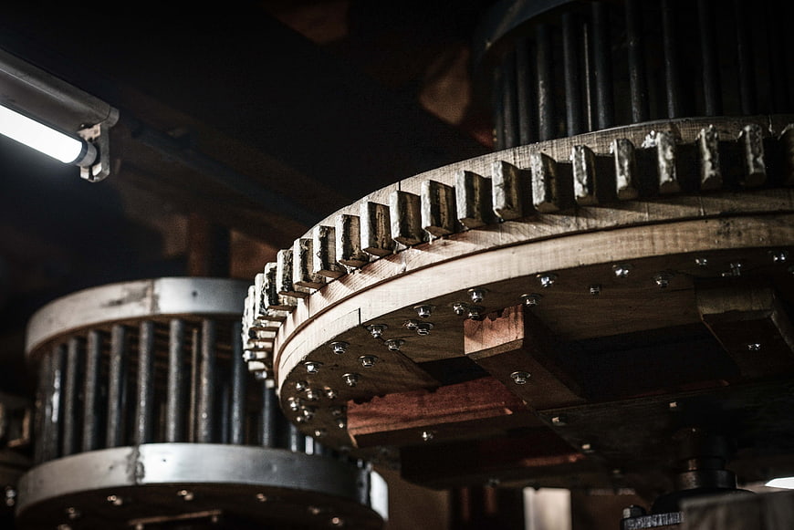 Close-up of vintage wooden industrial gears in a workshop