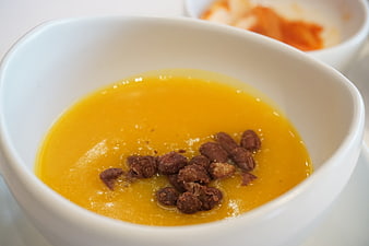 Korean Pumpkin Porridge with Jujube in White Ceramic Bowl