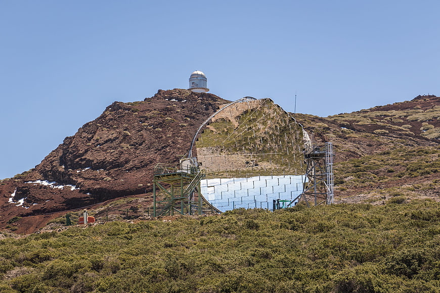 Radio telescope and observatory dome on volcanic mountain