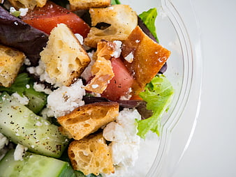 Close-up of fresh salad with croutons and feta cheese