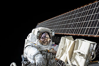 Astronaut Spacewalk with Solar Panel Background