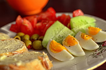 Healthy Breakfast Plate with Eggs, Bread, and Vegetables