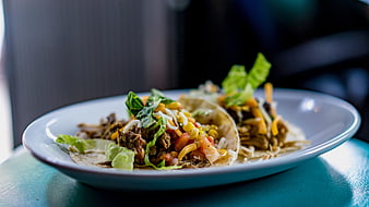 Delicious Beef Tacos with Corn and Lettuce on a Plate