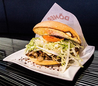 Delicious Döner Kebab Sandwich on White Plate