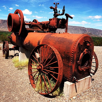 Rusty Vintage Steam Engine in Desert Landscape