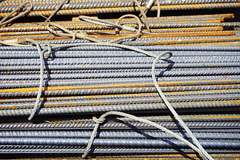 Stacked rusty rebar construction materials with wire ties