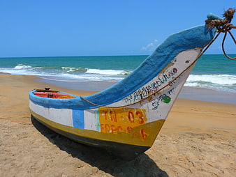 Colorful Fishing Boat on Sandy Beach with Ocean Waves