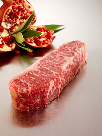 Raw Wagyu Beef Steak with Pomegranate Garnish