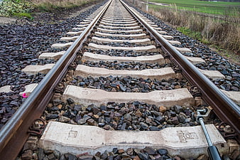 Low angle view of railway tracks stretching into the distance