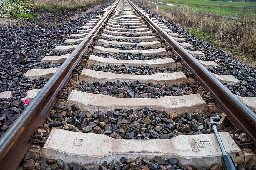 Low angle view of railway tracks stretching into the distance