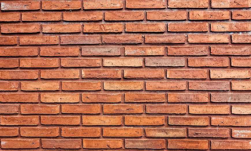 Textured Orange Brick Wall Background Pattern