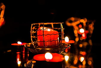Red Candle in Wire Cage with Floating Tea Lights