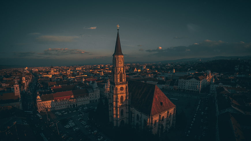 Aerial View of Historic Church Tower at Sunset