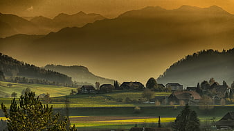 Golden Hour Mountain Village Landscape with Rolling Hills