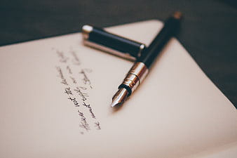 Vintage fountain pen on handwritten paper
