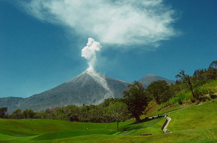 Volcano Erupting Behind Golf Course Fairway