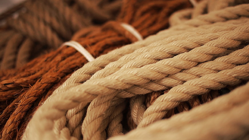 Close-up of thick twisted nautical ropes in beige and brown
