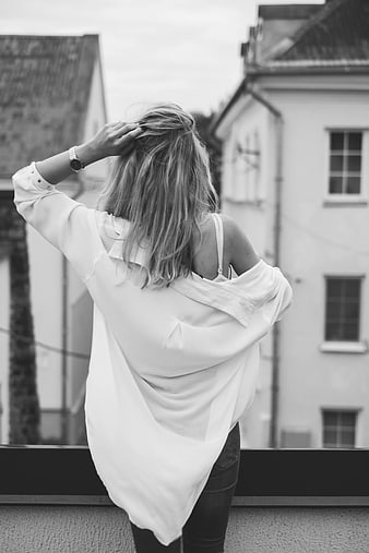 Woman in Oversized Shirt on Balcony Back View