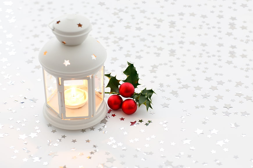 White Christmas Lantern With Candle And Holly Berries On Starry Background