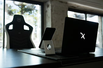 Modern Workspace with Laptop and Smartphone on Desk