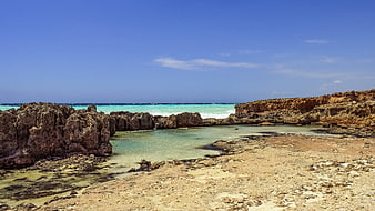 Turquoise coastal lagoon with rocky cliffs in Cyprus