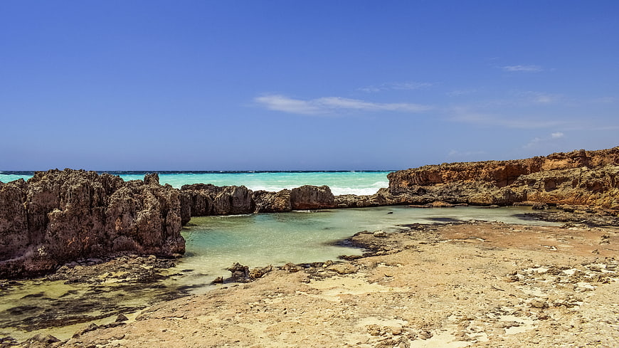 Turquoise coastal lagoon with rocky cliffs in Cyprus