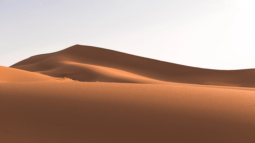 Golden Sand Dunes Under Clear Sky