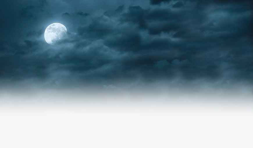 Full Moon in Cloudy Night Sky with White Copyspace