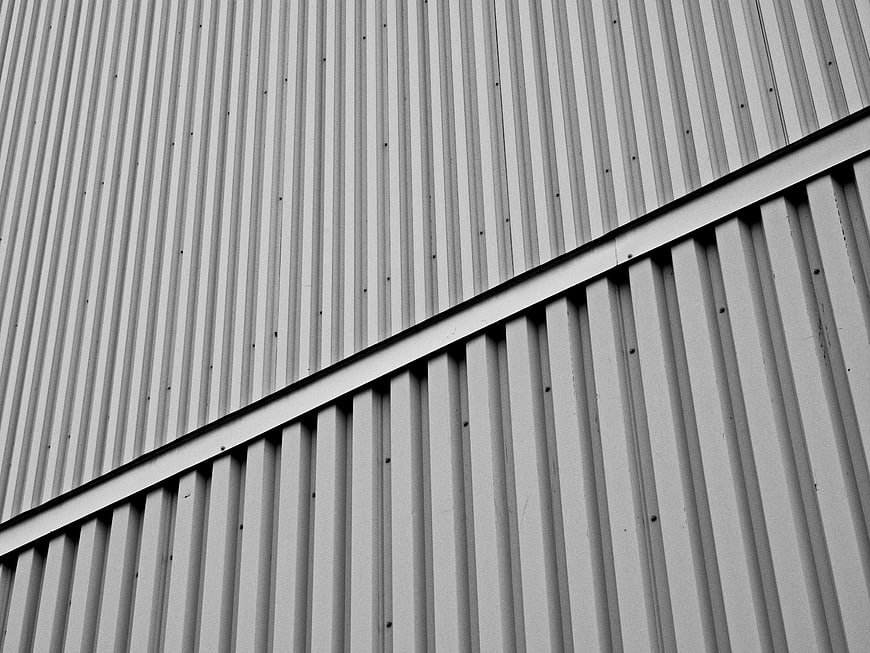 Abstract black and white corrugated metal wall texture