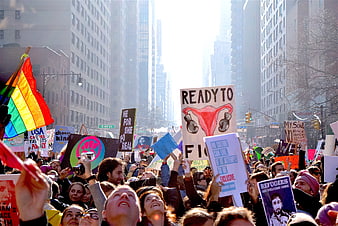 Crowd at Women's March with Protest Signs and Rainbow Flag
