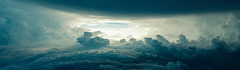 Dramatic Storm Clouds with Sunlight Breaking Through