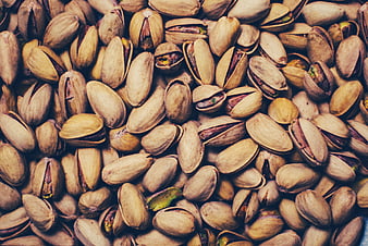 Close-up texture of roasted pistachios in shells