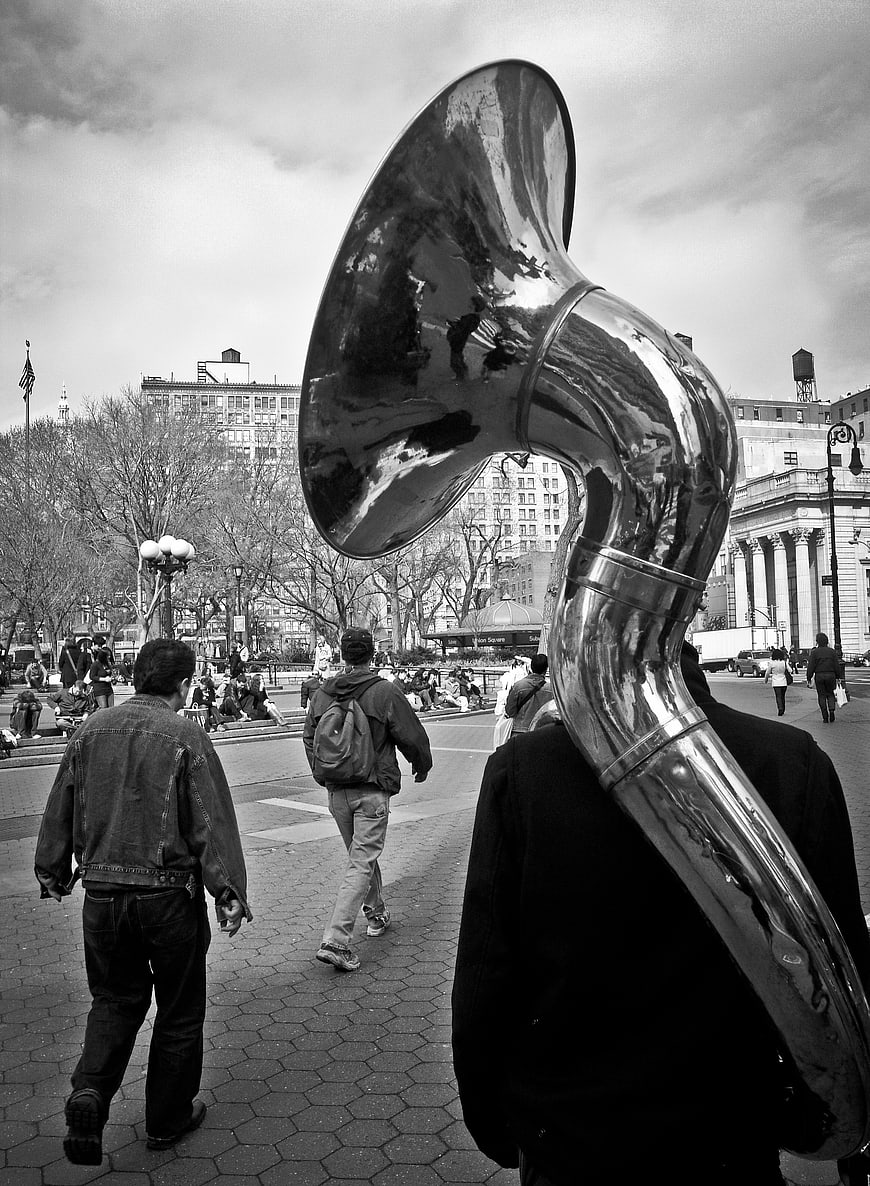 Street Musician Playing Tuba in City Plaza