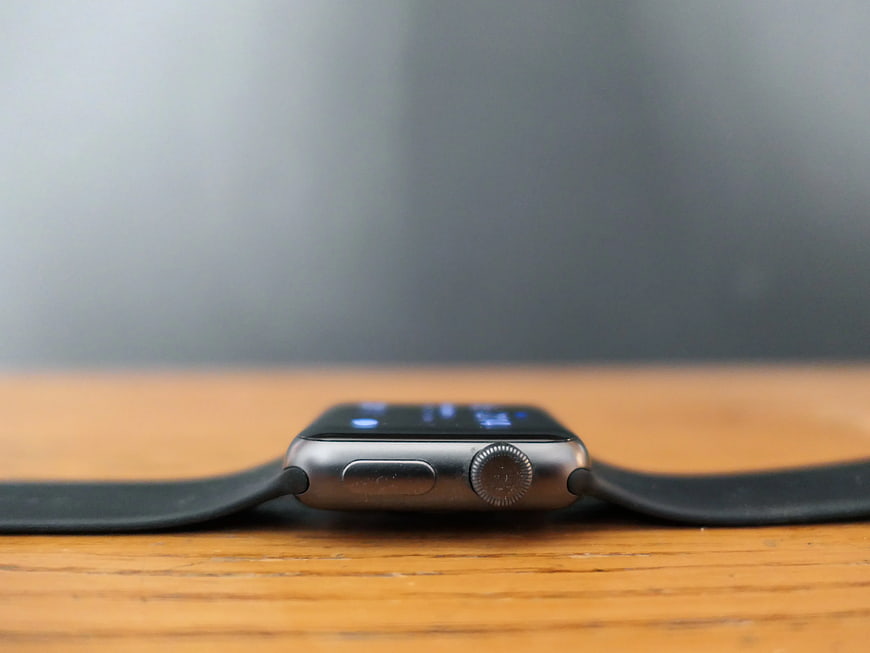 Side View of Smartwatch on Wooden Table