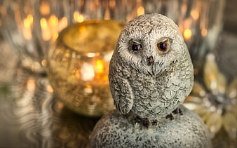 Snowy Owl Figurine With Candlelight And Festive Bokeh