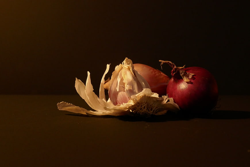 Dramatic Still Life of Garlic and Red Onions