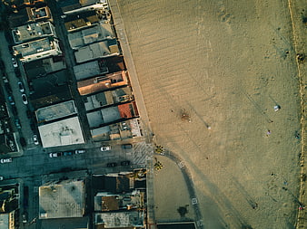 Aerial View of Coastal Neighborhood and Sandy Beach