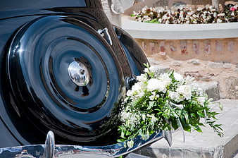 White Wedding Bouquet on Vintage Black Car Fender