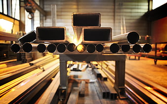 Steel pipes and tubes in industrial workshop