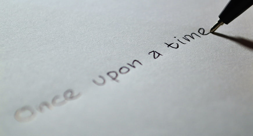 Pen writing once upon a time on white paper