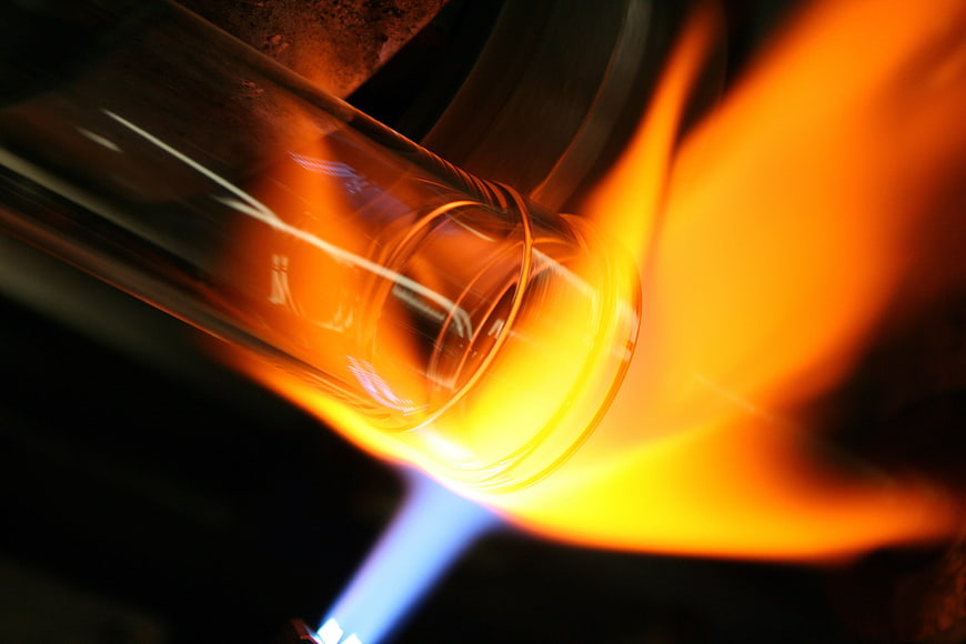 Glass Tube Heated by Blue Flame in Laboratory Setting