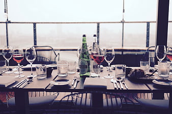 Elegant Table Setting with Wine and Sparkling Water